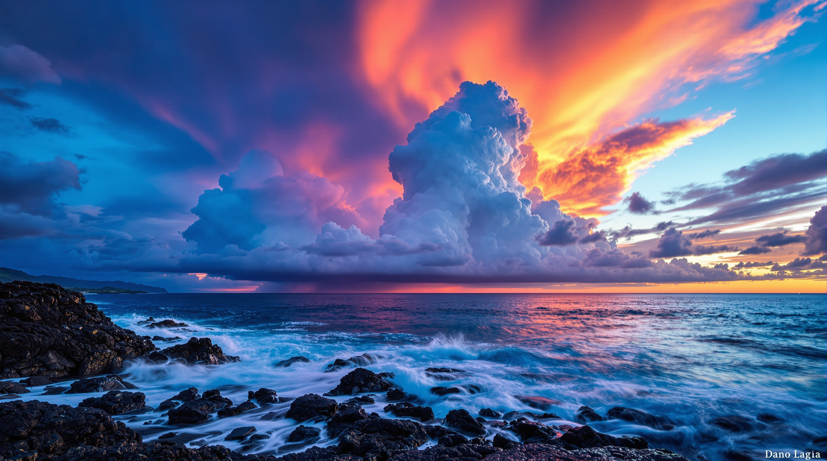 Dramatic sunset seascape over lava rocks on Kauai